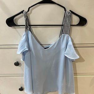Baby blue top with black and white straps